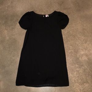 Black shift dress with tulip style sleeve
